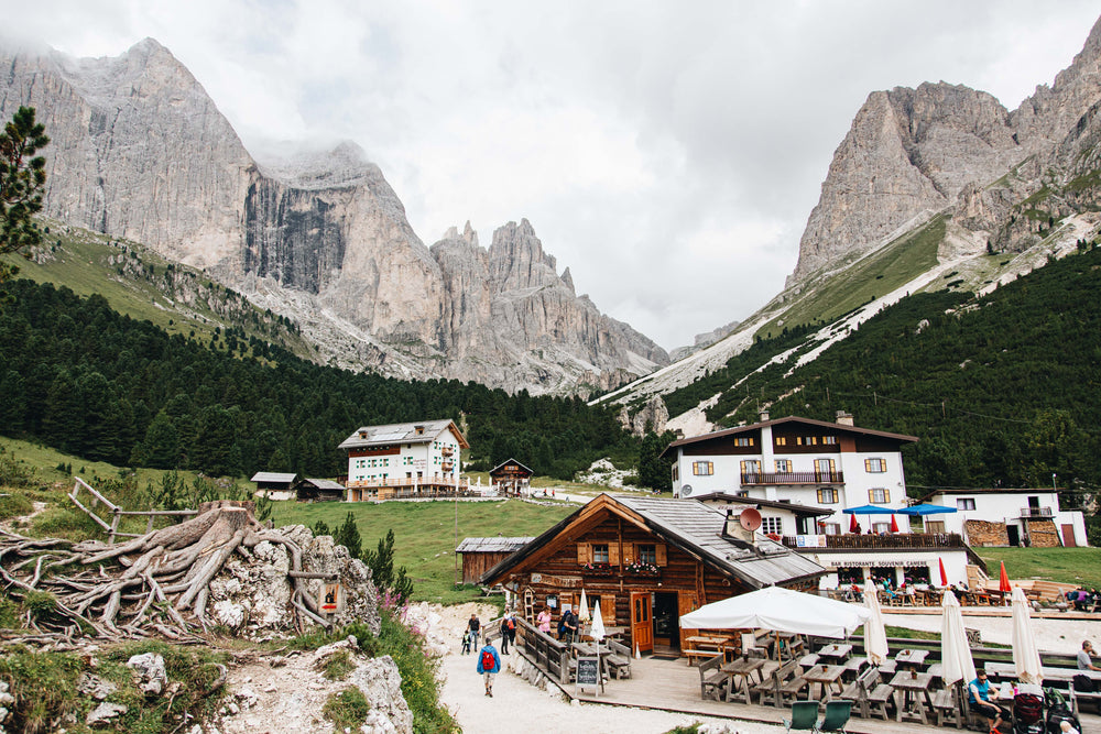 clouds drift over mountains above a valley town