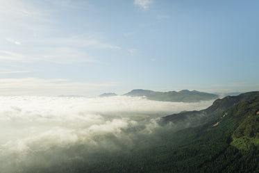 clouds drifting over mountains