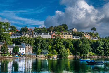 clouds rolling over seaside town