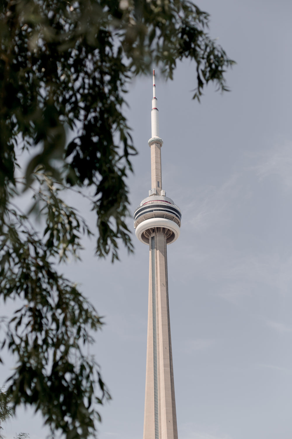 cn tower against the blue toronto sky