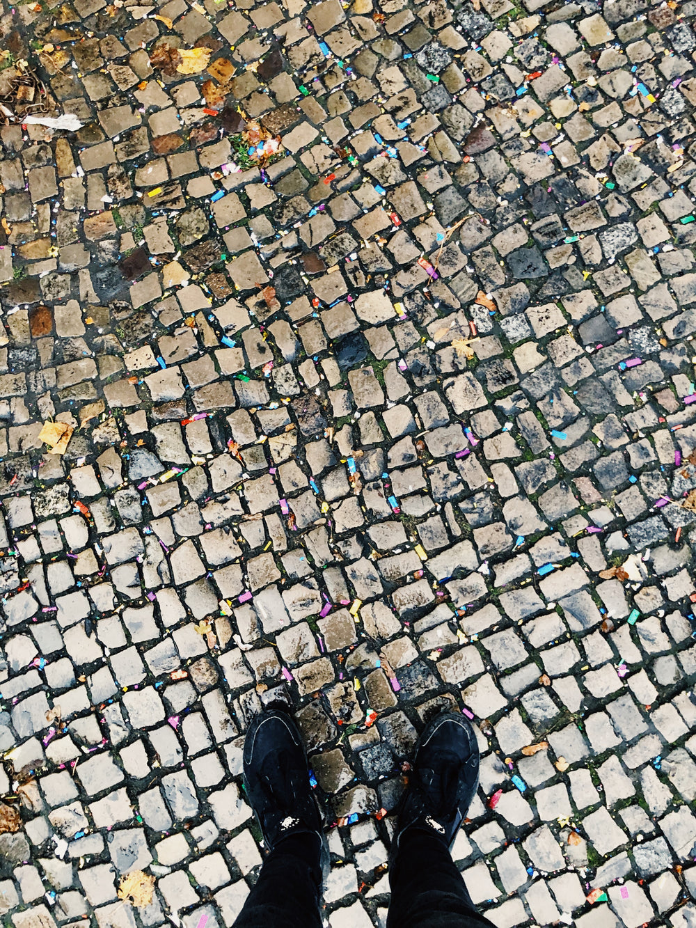 cobblestone streets and littered confetti