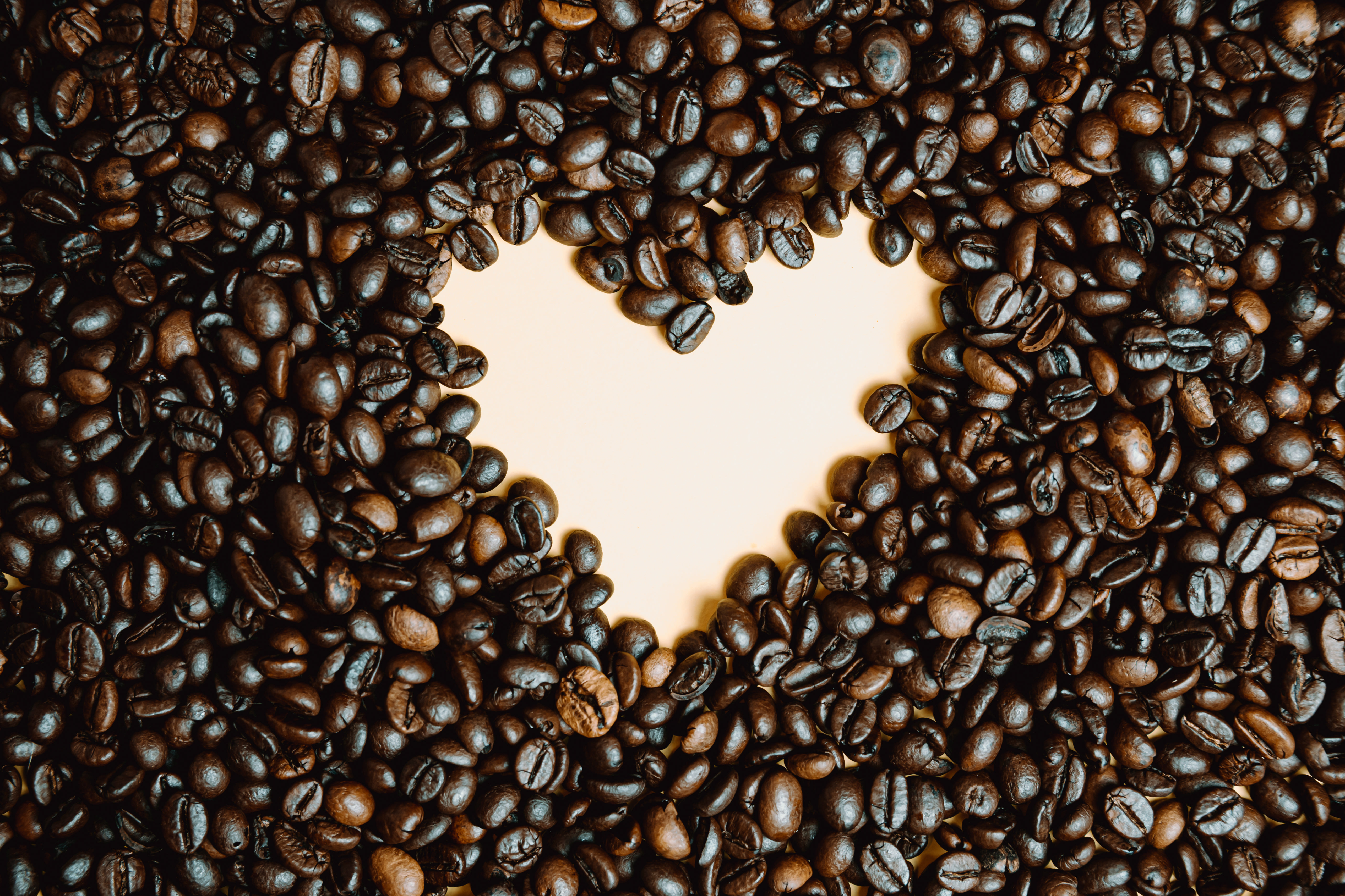 Coffee Beans Laid On A Pink Background