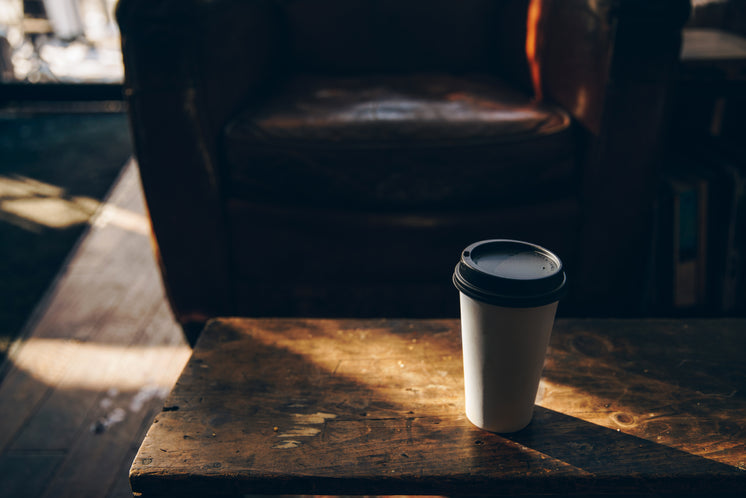 Coffee Cup On Wooden Table