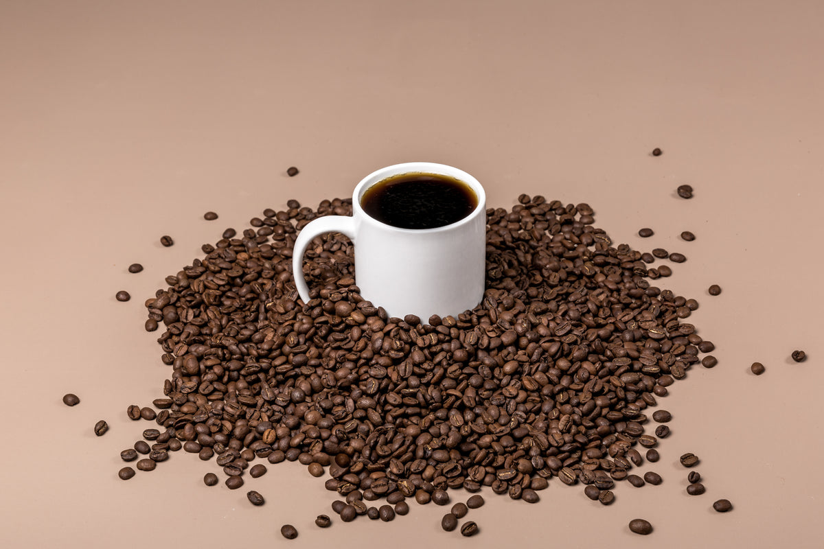 coffee mug in bean pile