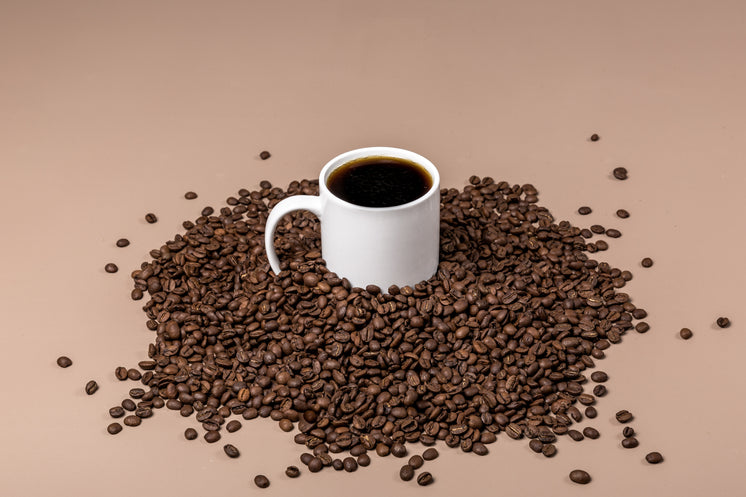 Coffee Mug In Bean Pile