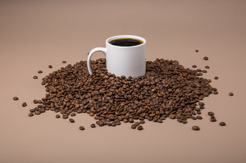 coffee mug in beans