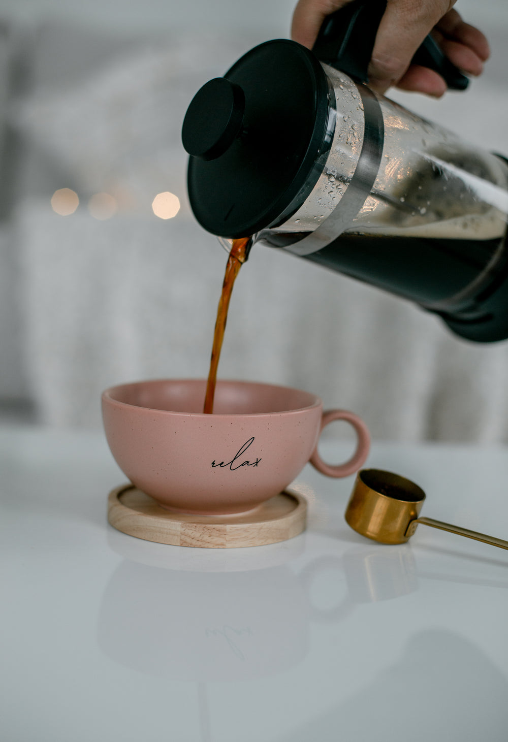 coffee pours from a french press