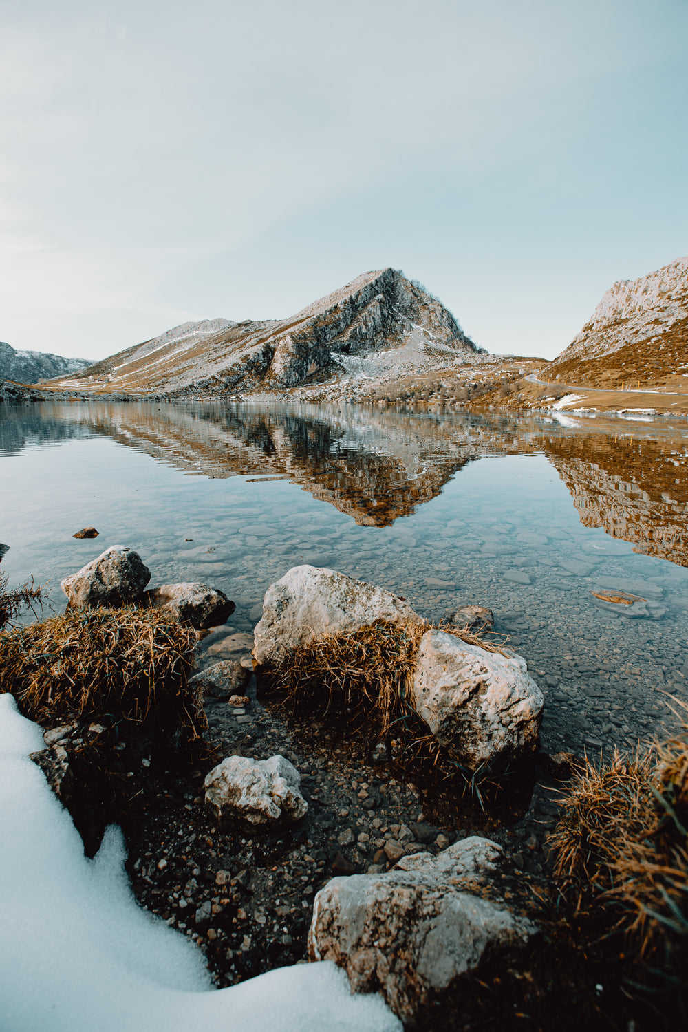 cold lake waters and distant mountains