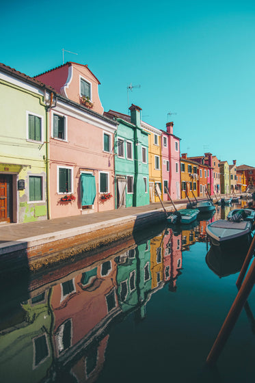 colorful buildings line along a river