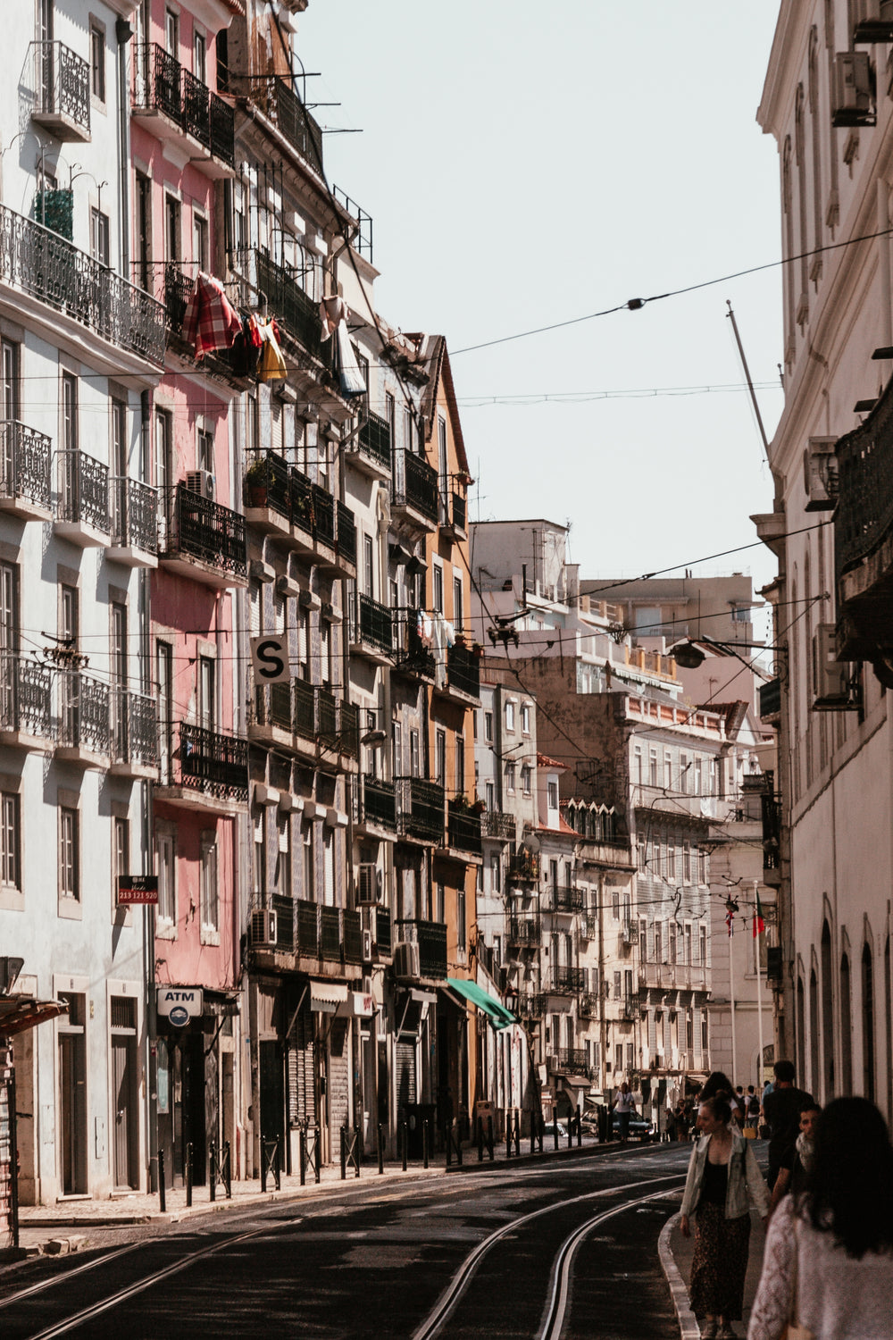 colorful buildings line compact lisbon street