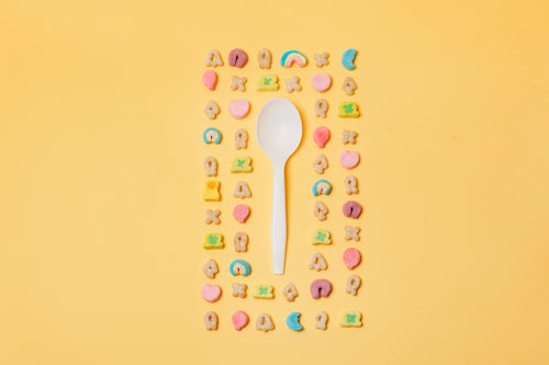 colorful cereal flat lay surrounding spoon