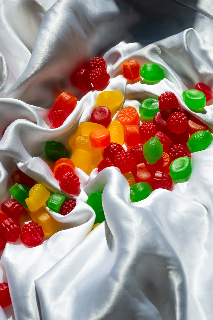 colorful-jube-jubes-scattered-on-a-white