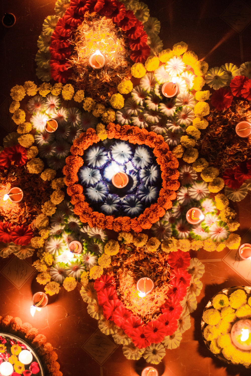 colorful rangoli pattern with candles