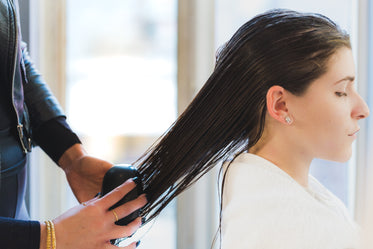 combing hair at salon