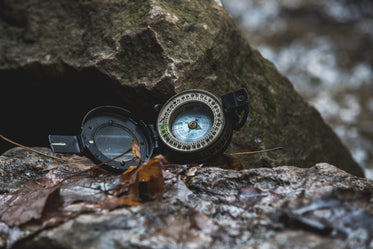 compass on rocks close-up