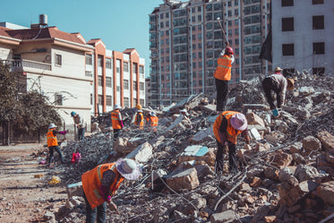 contruction workers on demolished building