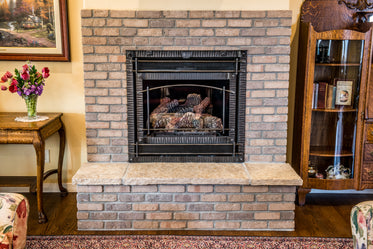 cosy exposed brick fireplace