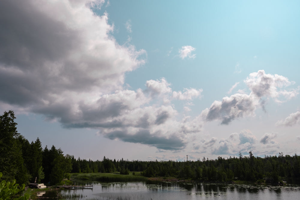 cottage lake cloudy sky