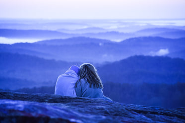 couple cuddles watching over nature