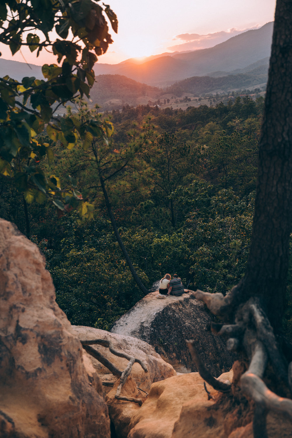 couple gets cozy during sunset