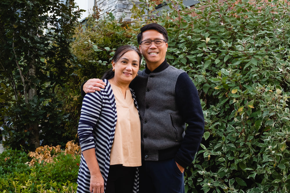 couple hug and smile in their garden