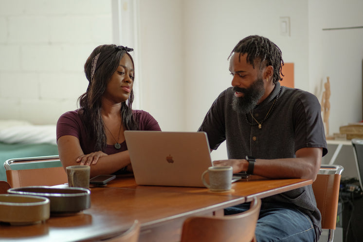 Couple In Conversation At The Dining Table