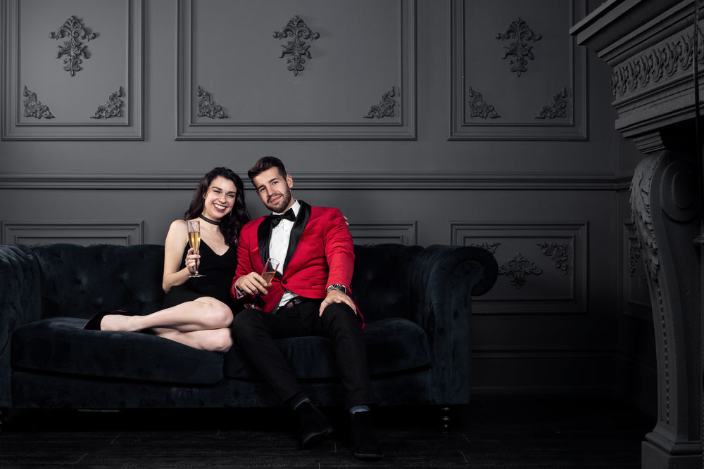 couple in formal wear cozy up with champagne