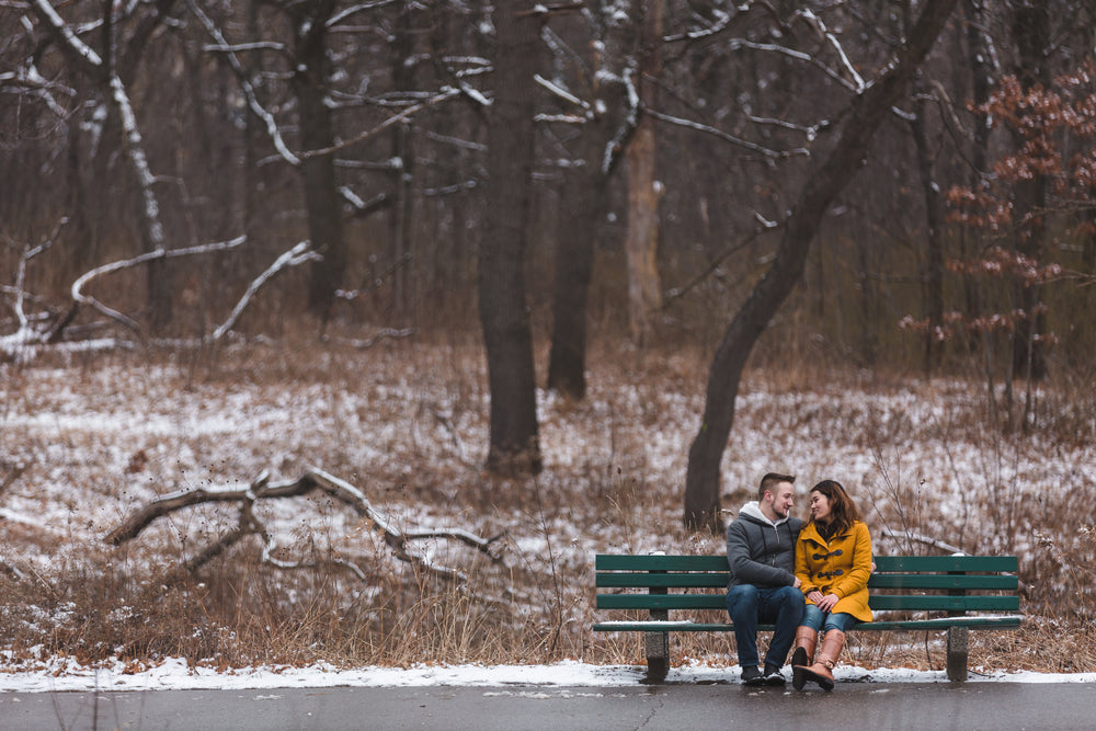couple in love on park bench in winter