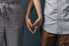 couple making heart sign with hands