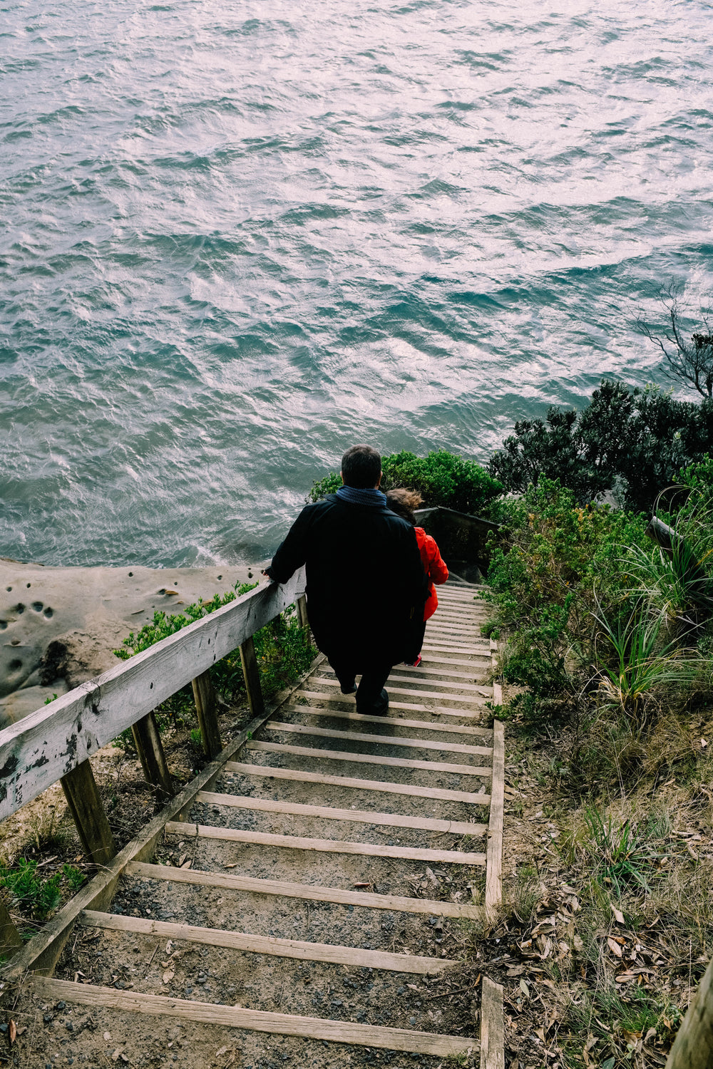 couple on seafront steps