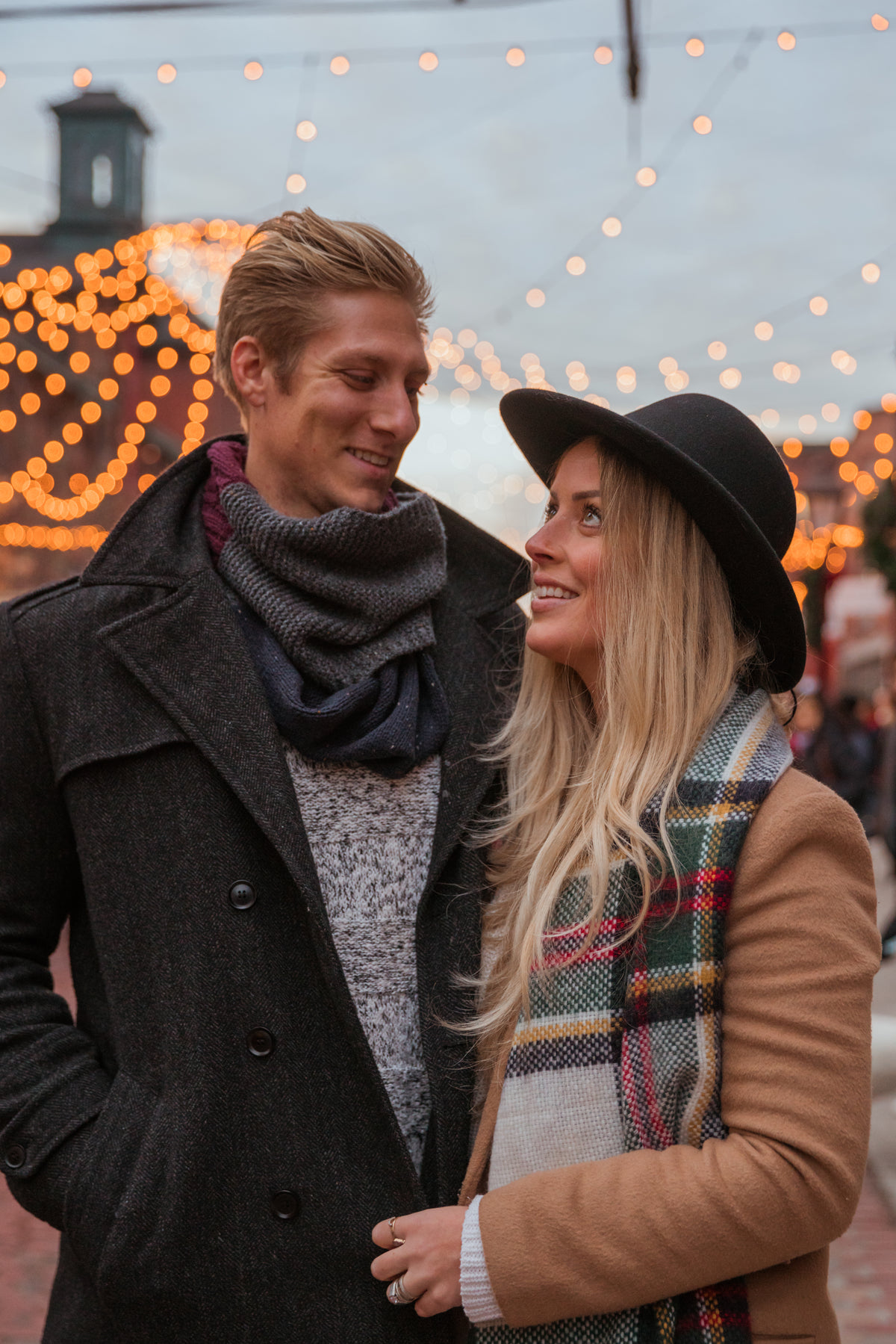 couple portrait in holiday lights