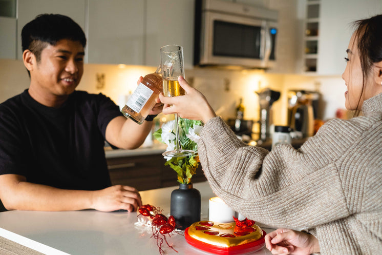 couple-raises-their-glasses-to-cheers-in-their-kitchen.jpg?width=746&format=pjpg&exif=0&iptc=0