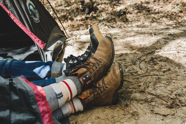 couple relax on camping trip in tent