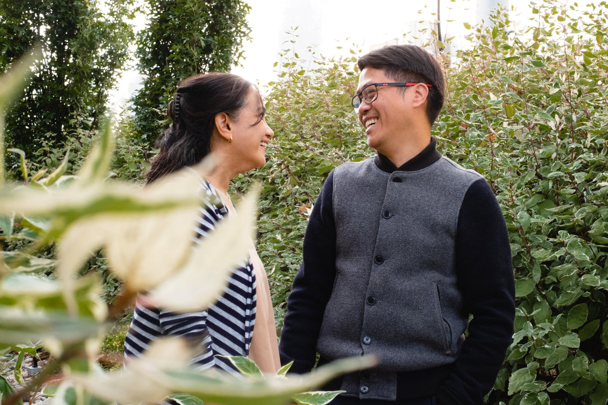 couple share a laugh in a garden
