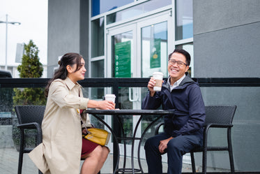 couple sits on patio laughing