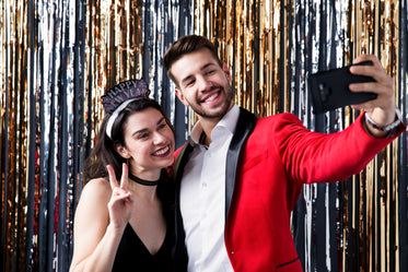 couple taking a selfie at a party