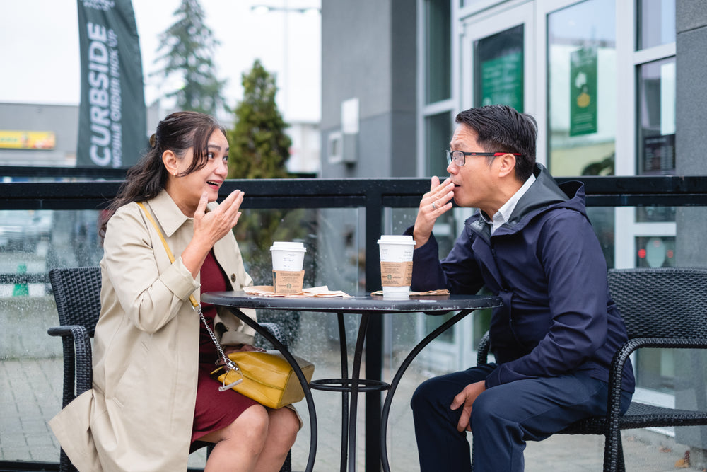 couple talking outside in cafe patio