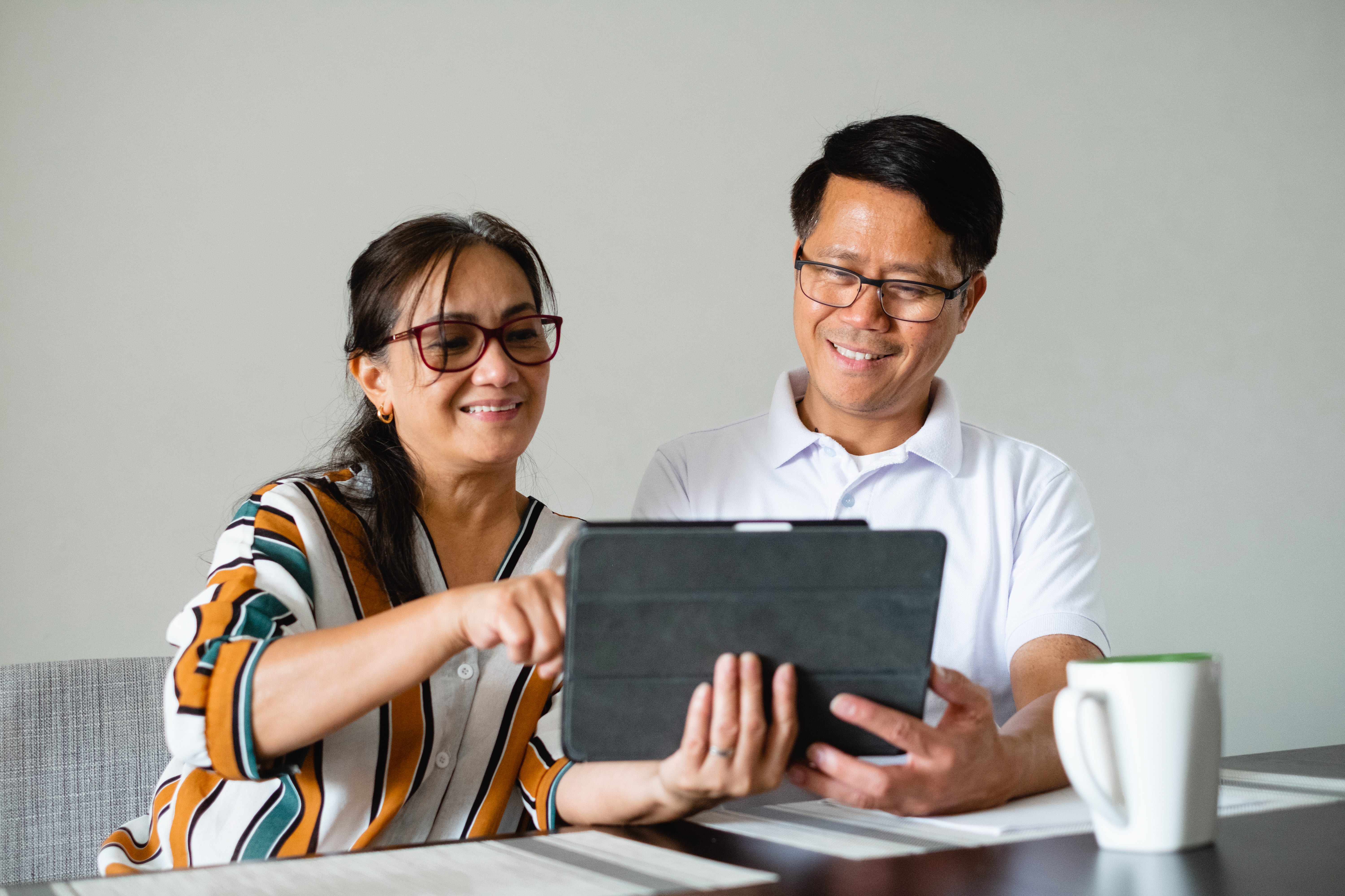 Couple Use A Tablet Together