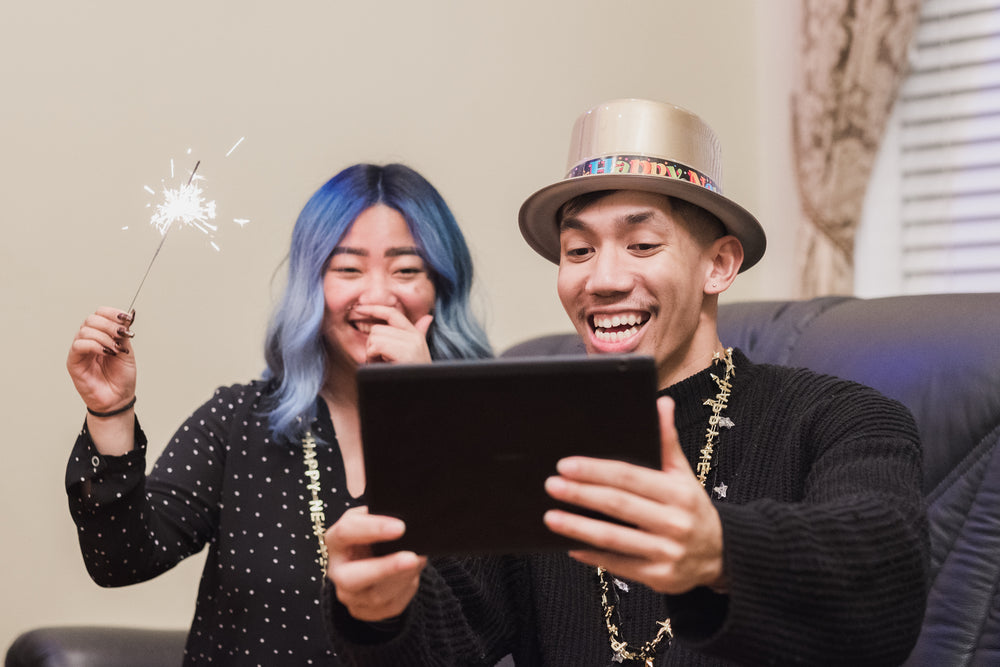 couple video calling family on new years eve