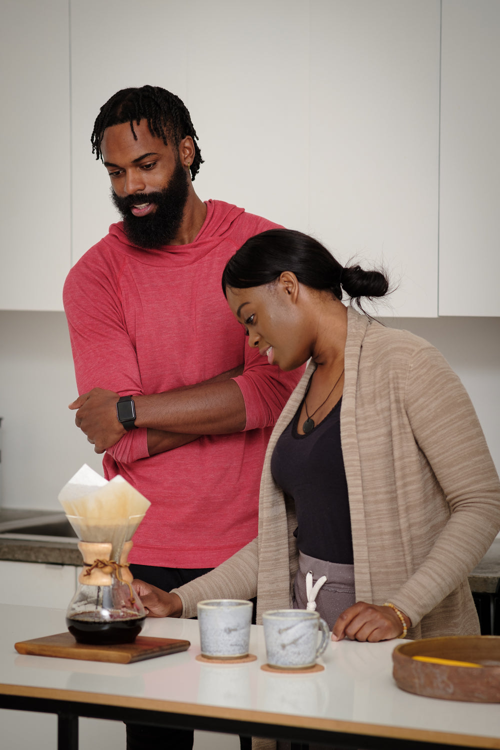 couple wait for their coffee to brew