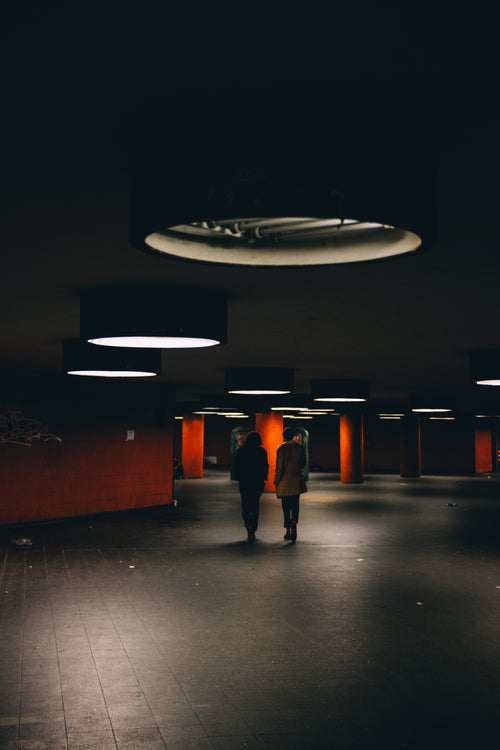 couple walk through underground passage