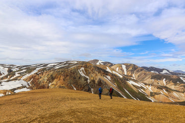 couple walks in mountains