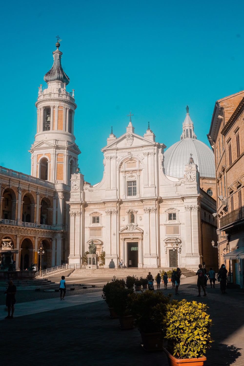 courtyard on a sunny day with a large white church