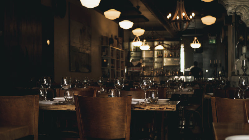 a restaurant with a lot of empty tables and chairs - cozy empty restaurant