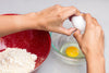 cracking egg for baking