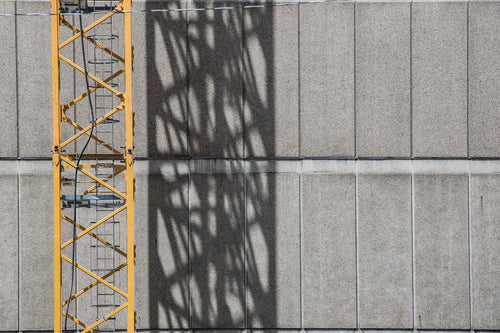 crane shadow on building
