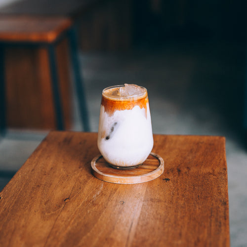 Creamy Cold Drink Sits On A Wooden Table