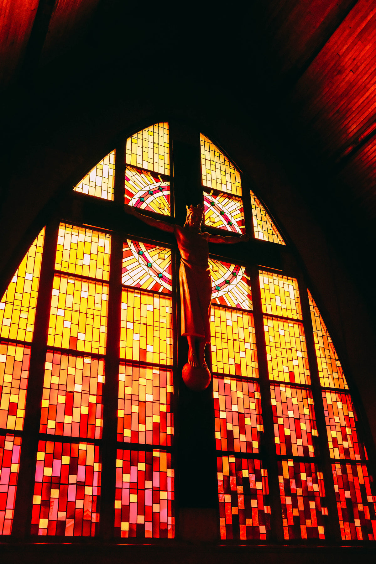 crucifix by stained glass