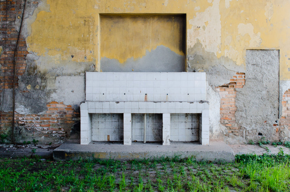 crumbling plaster brick wall