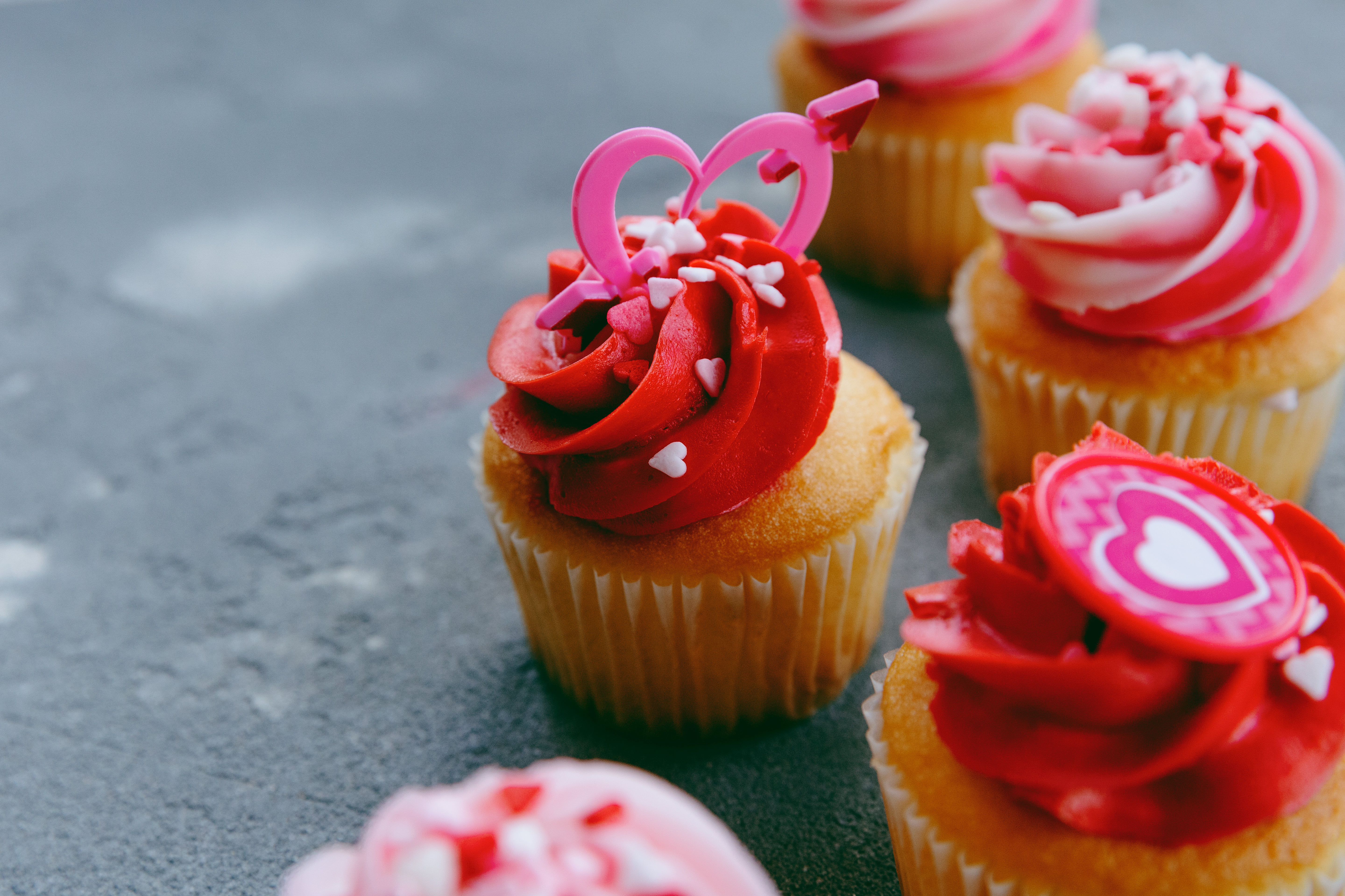 Cupcakes With Red Icing And Small Confetti Hearts